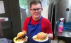 Aaron James Ferguson helping with making burgers at Kinross Golf Club.