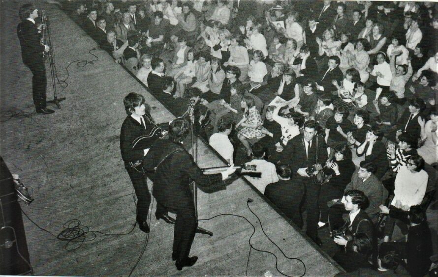 The Beatles on stage at the Caird Hall, Dundee.