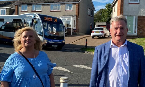 Councillor Carol Lindsay and MSP David Torrance in front of the no 14 bus