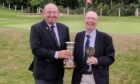 Cupar Golf Club captain Neil Winton (left) with Peri Cup holder and 2022 winner Hugh Ironside of Cupar, pictured at Burntisland