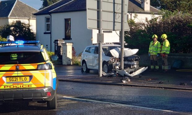 The taxi crashed into a sign on Arbroath Road in Dundee. Image: Paul Reid