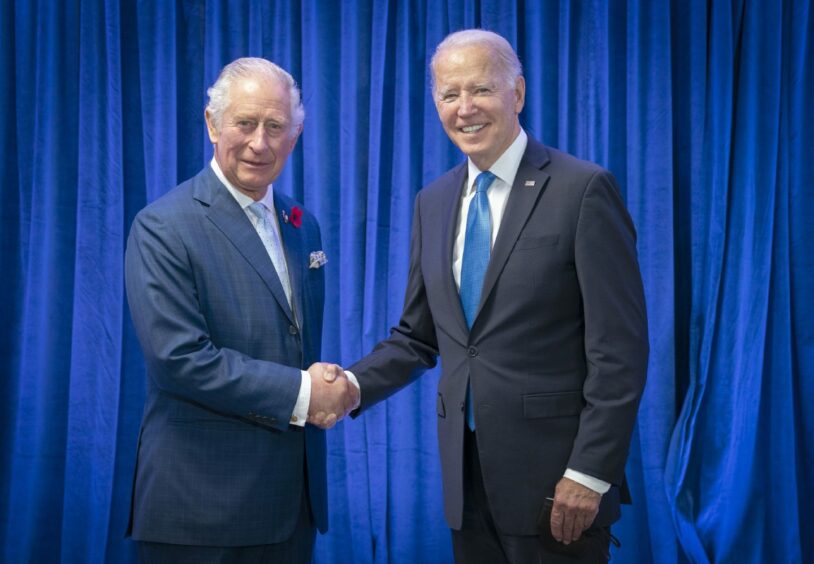 The then Prince Charles greets the President of the United States, Joe Biden, at COP26.