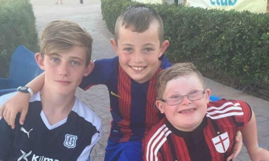 Aaron (right) with his older brother Rory and younger brother Jamie when they were youngsters.