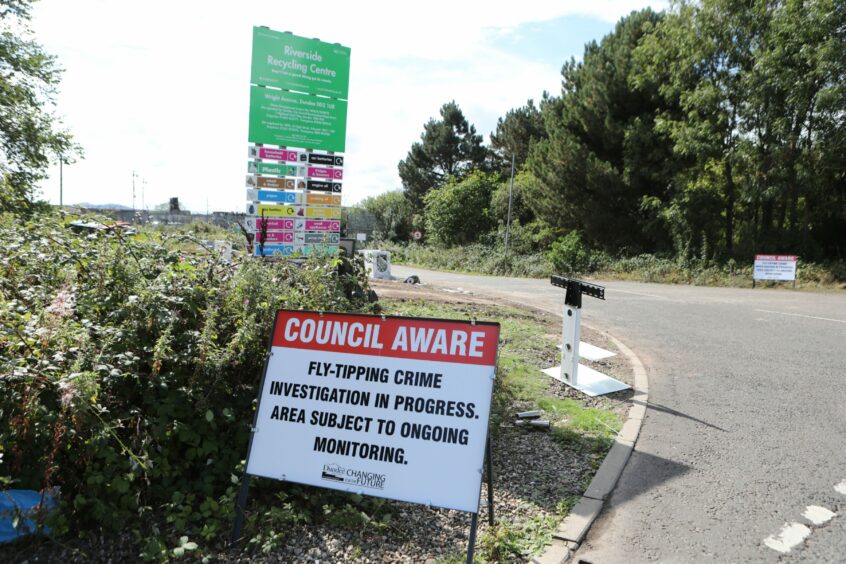 Sign warning of crime investigation against fly-tipping. 