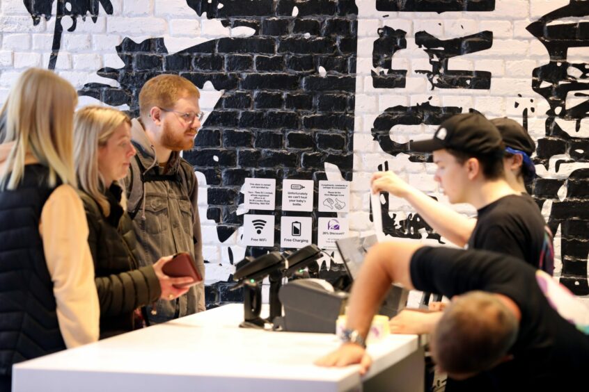 Customers placing their orders at the counter in Taco Bell.