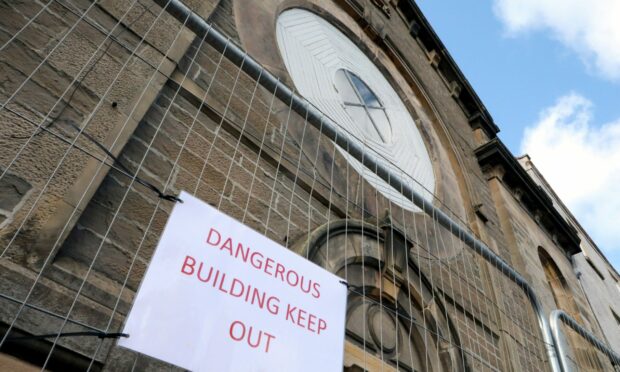 'Dangerous building' signage around the former Regal cinema on Queen Street in Broughty Ferry. Image: Gareth Jennings/DC Thomson.