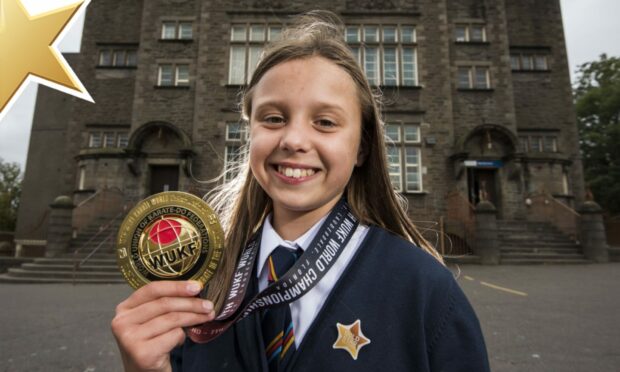 Dundee pupil Aubree Craig, aged nine, with her World Championship medal and Gold Star.