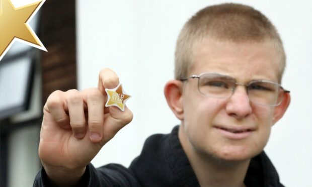 Robert Healey with his Gold Star. Pictures by Gareth Jennings/DC Thomson.
