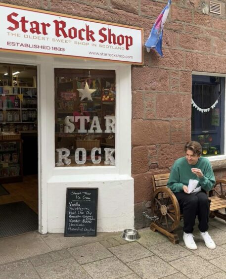 Greg James outside Star Rock Shop in Kirriemuir.