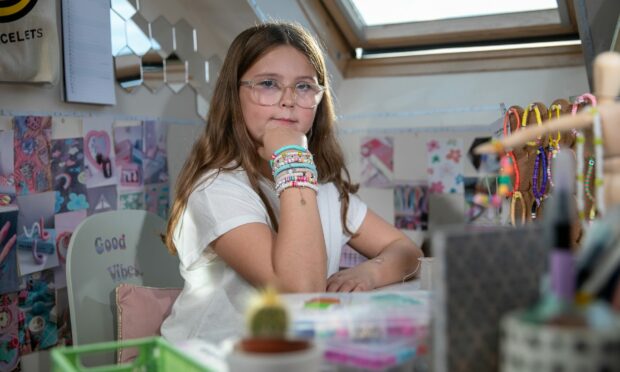 Aila Douglas Selway, 10, runs her business Cute Bracelets from her bedroom.