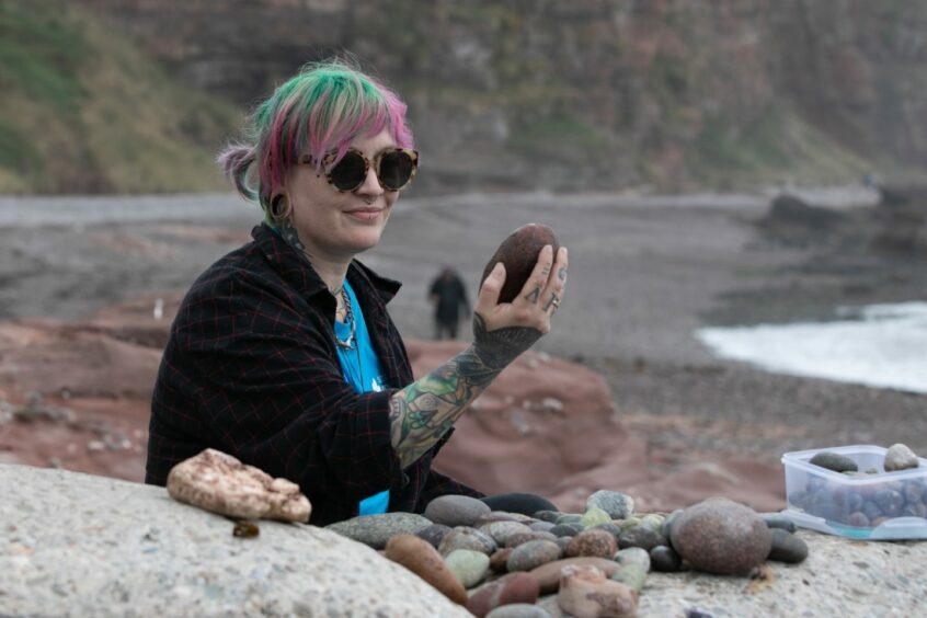 Katie Strang of the Scottish Geology Trust on the pebble beach.