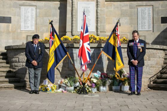Colin Deering and Carnoustie Legion chairman Davie Paton stand vigil at the war memorial during the funeral service. Pic: Kim Cessford/DCT Media.