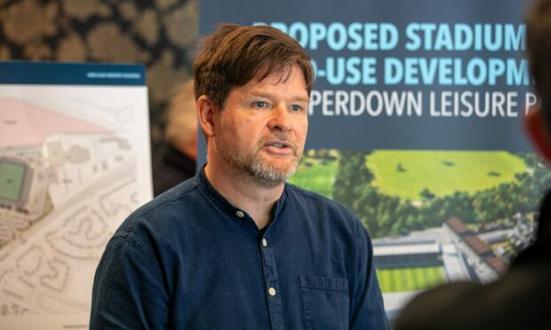 The lead architect for the Dundee FC stadium bid is Mark O'Connor. This image shows Mark presenting at a consultation event for the stadium.