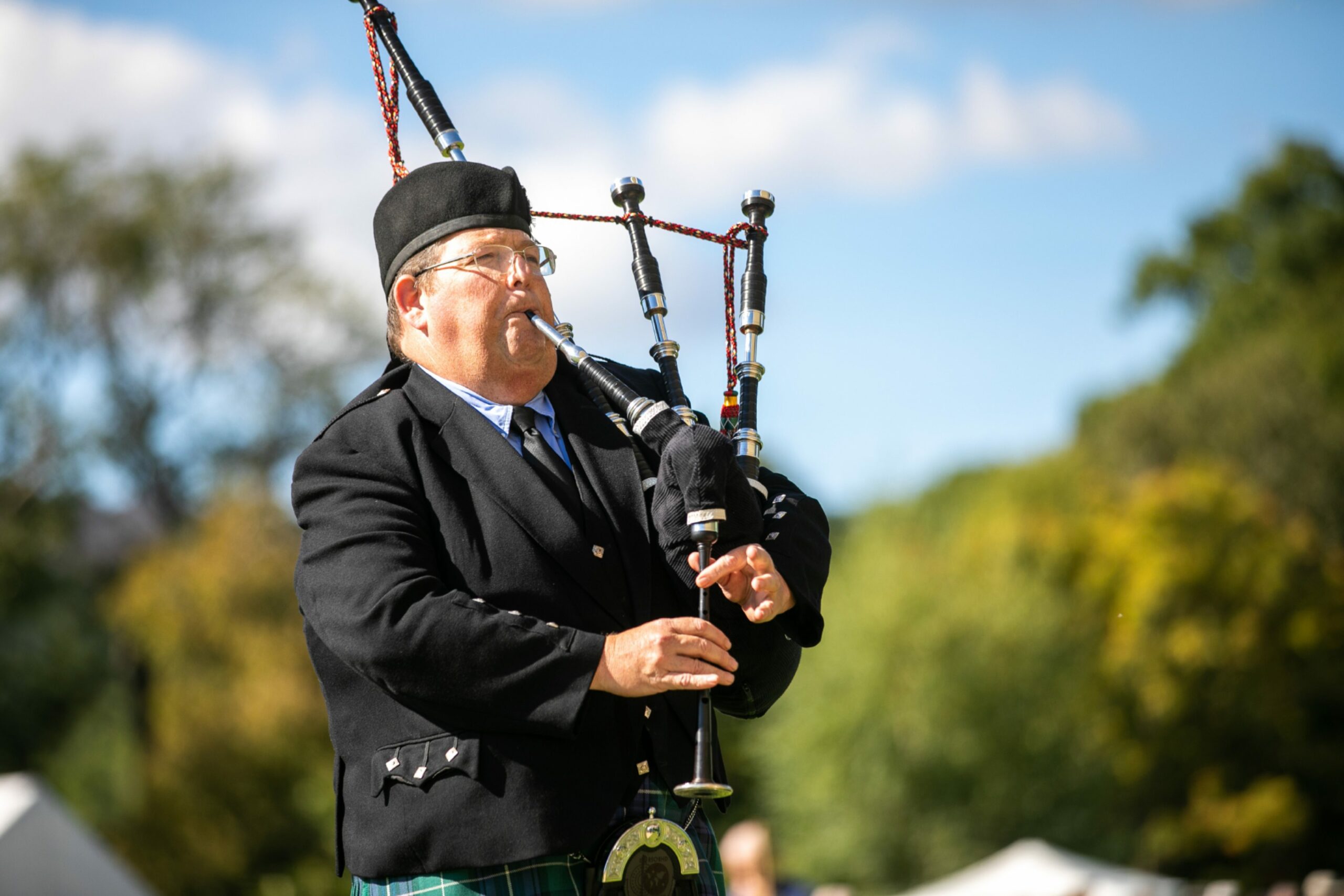 Lone piper Donald McPhee plays in tribute to the Queen.