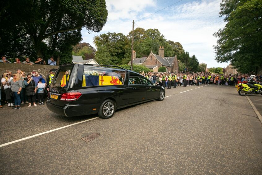The Queen's cortege arrives at the gates of Brechin castle. 