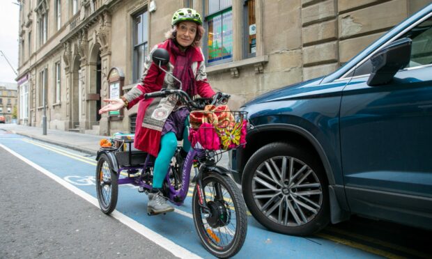 Valentine Scarlet avoids a vehicle parked in the Bank Street cycle lane.