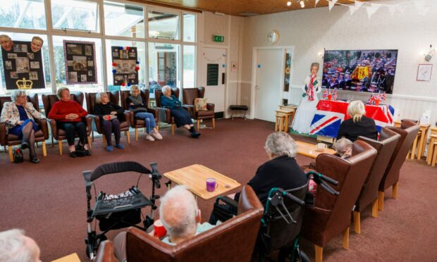 Residents of Glencairn House watching the funeral of the Queen in the TV lounge.