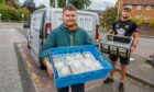 Super Lean workers Nathan Levers, left, and Kieran Warrender helped to hand out hundreds of free meals