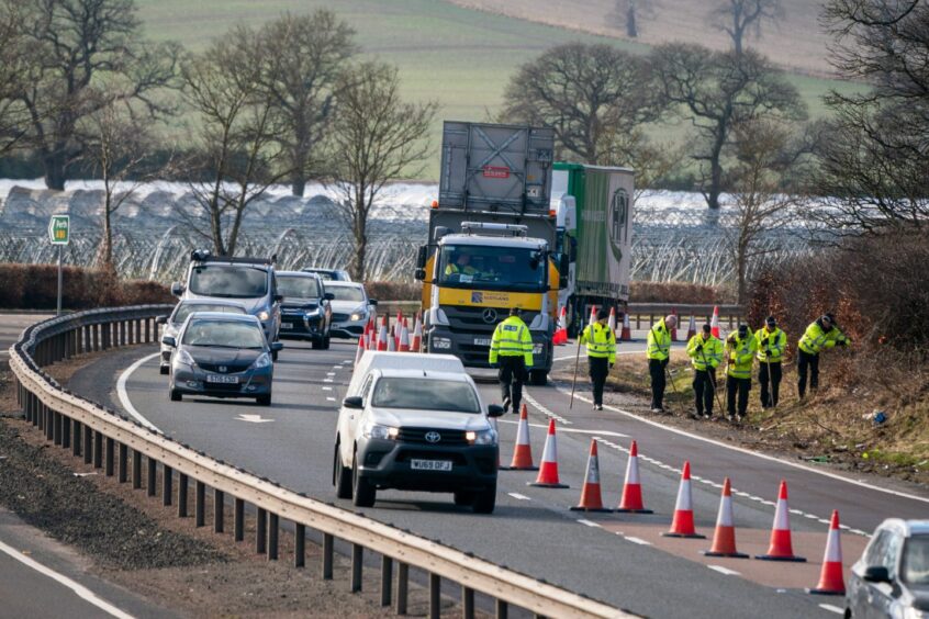 Police investigate the collision on the A90 near St Madoes in February, last year.