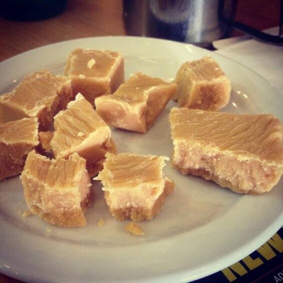 Photo shows a dish of Scottish tablet - a treat made with sugar and butter.