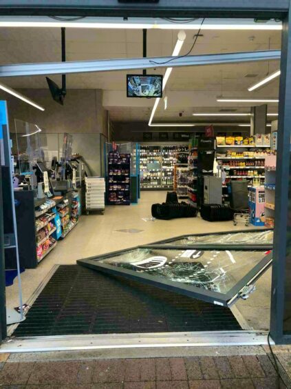 The damage to the Co-op doors.