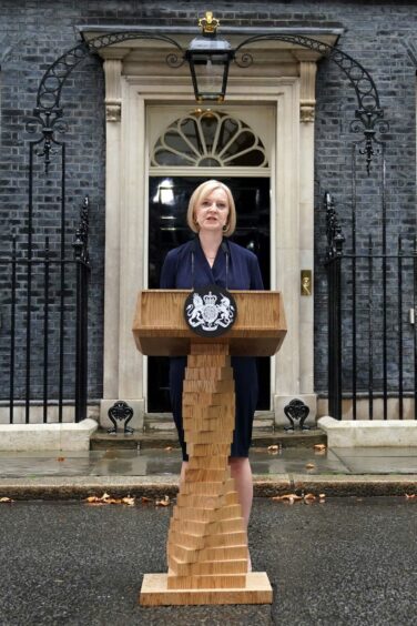 Photo shows prime minister Liz Truss speaking at a lectern outside 10 Downing Street.