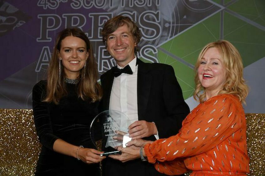 Producer Morven McIntyre and political editor Andy Philip receive award.