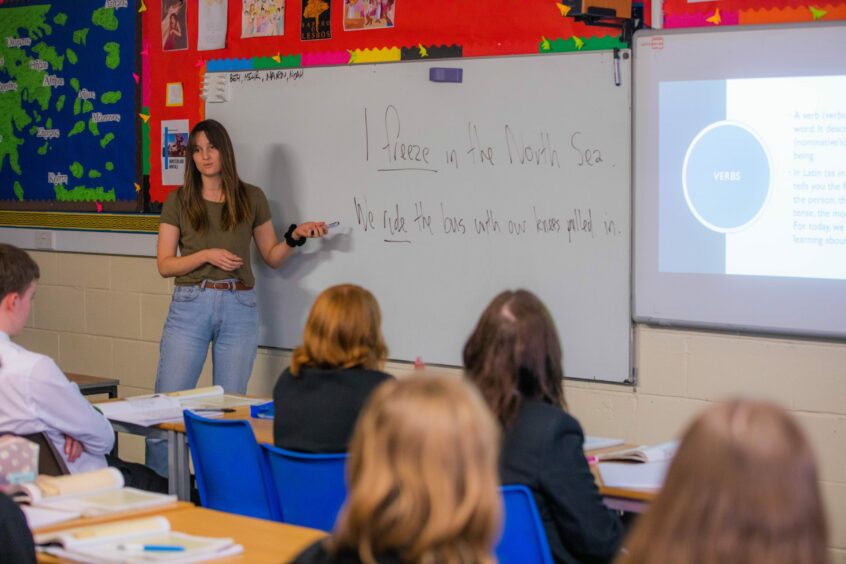 Florence Rogers, a St Andrews University PhD student, teaching the class at Monifieth High School. 