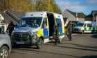 Police on a human trafficking raid in Perthshire last year