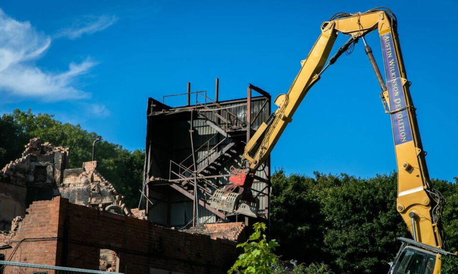 The building collapsed in on itself as the Lundin Links Hotel demolition began