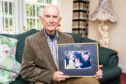 Sandy Ingram with his treasured photo of the 2004 Royal visit. Pic: Steve Brown/DCT Media.
