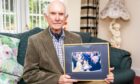 Sandy Ingram with his treasured photo of the 2004 Royal visit. Pic: Steve Brown/DCT Media.