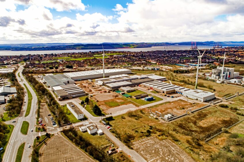 aerial view of the Michelin Scotland Innovation Parc with Dundee and the River Tay behind.