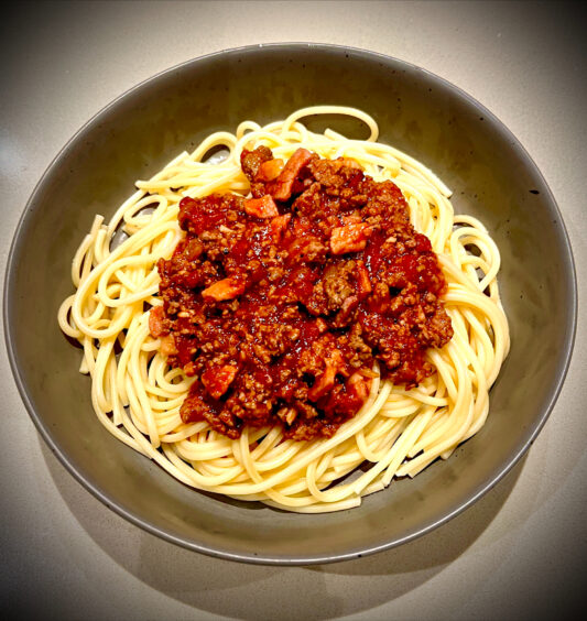 A picture of spaghetti bolognese in a dish, it is one of the cheap healthy meals suggested by Scott's Brothers