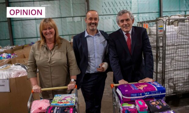 Gordon Brown with  Fife charity partners Pauline Buchan, head of the Cottage Family Centre. and John Boumphrey, UK country manager at Amazon. Gareth Easton/Amazon/PA Wire.