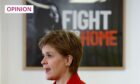 photo shows Nicola Sturgeon in front of a poster which says 'Fight for home'.