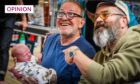 photo shows Still Game stars Ford Kiernan and Greg Hemphill holding a very small baby and smiling at a signing event in Dundee.