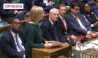 photo shows Liz Truss with members of her front bench in the House of Commons.