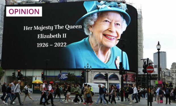 A billboard honouring Queen Elizabeth II. Pietro Recchia/SOPA Images/Shutterstock.