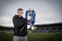 Raith Rovers' Kyle Connell with the SPFL Trust Trophy.