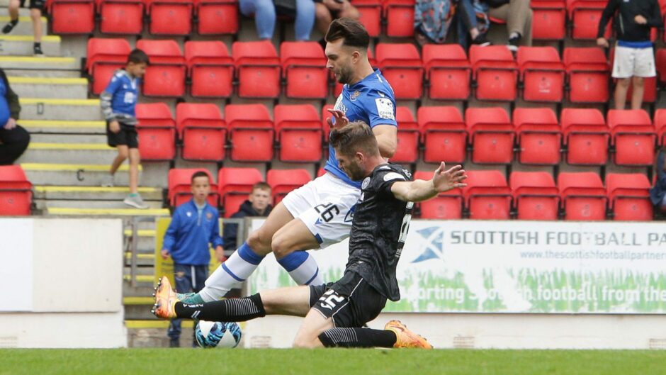 Connor McLennan is fouled in the box by St Mirren's Marcus Fraser, earning Saints a penalty.