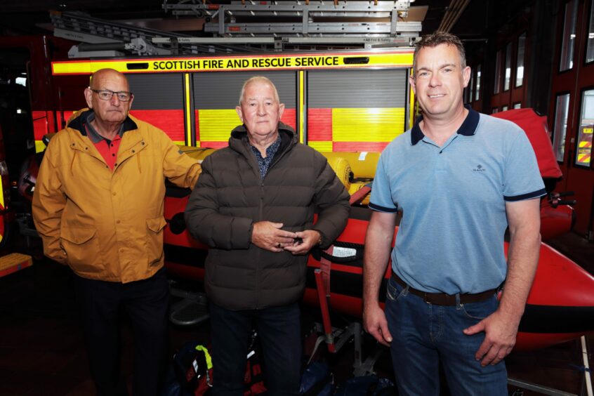 At Perth Fire Station retired firefighters Tam Sutherland and Gus McCabe, with firefighter Struan Drummond