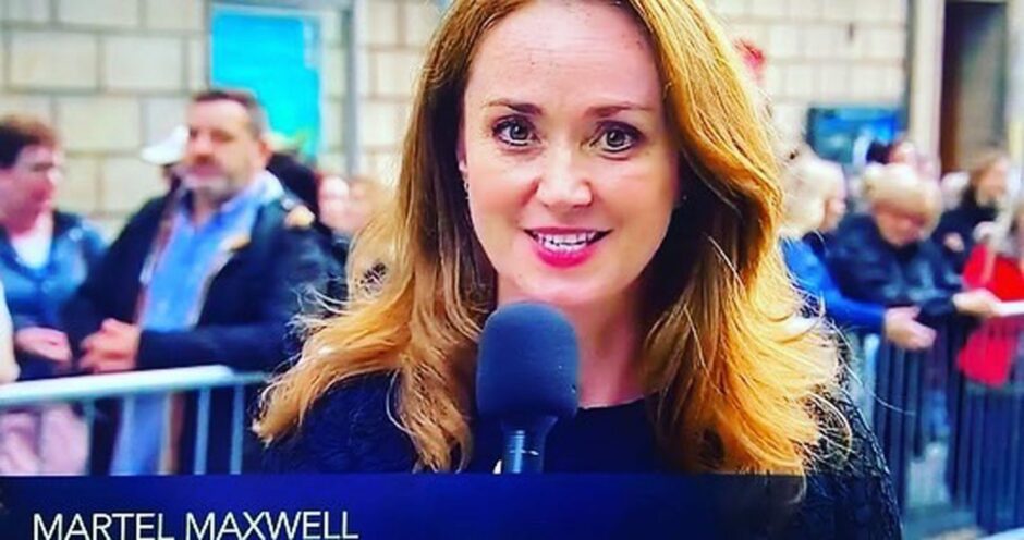 Photo shows a screengrab from the television with the presenter Martel Maxwell speaking into a microphone in front of a crowd of people on the street in Edinburgh.
