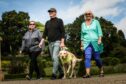 Greg Christie with his guide dog Baxter and Carol Wood (left) and Hazel Reid (right).