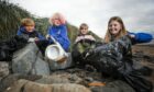 Claypotts Castle Primary pupils on Broughty Ferry beach with items of plastic waste