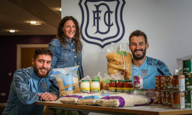 Dundee defender Ryan Sweeney, bookkeeper Ally Galloway and goalkeeper Adam Legzdins with the foodbank donations.