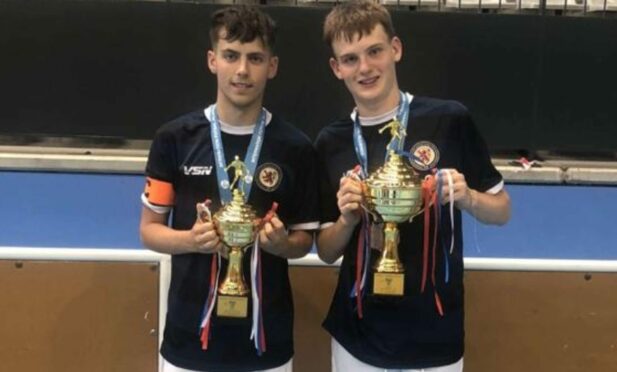 Jack Keast with the under 17s 3rd place trophy and Sam Currie with the under 21s 2nd place trophy from the IFA World Championships.