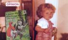 A young Lindsay Bruce and a copy of the Little Red Riding Hood book