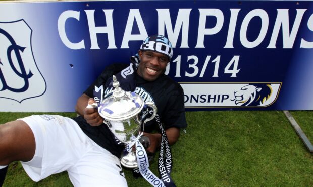 Christian Nade with the Championship trophy in 2014. Despite the smile, he was struggling with his mental health.