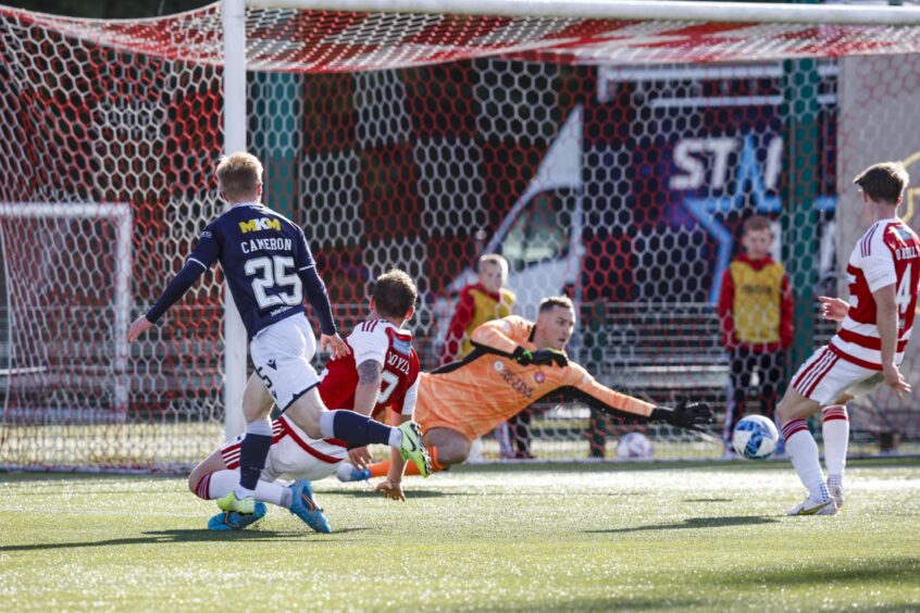 Lyall Cameron opens the scoring for Dundee with a left-footed strike.